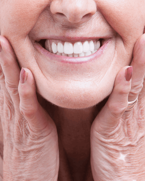 Smiling older patient with natural-looking, comfortable dentures